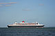 QM2 passing Calshot Spit light.JPG